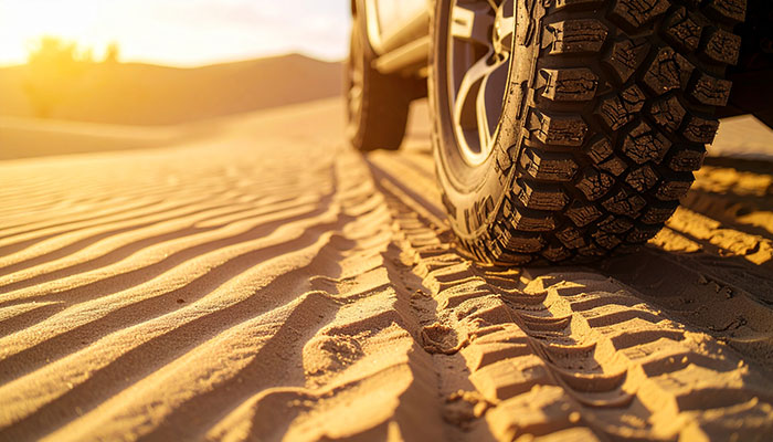 Expanded tire contact patch on sandy terrain from airing down tires